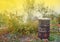 Autumn activity in garden, burning leaves, branches and dry grass in a old rusty barrel. Air pollution from farmers in the