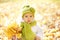 Autumn Baby Portrait In Fall Yellow Leaves, Little