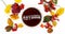 Autumn background. Colorful leaves, the word `autumn` in tea and redberries.