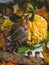 Autumn background with colorful mixed leaves, pumpkin, berries and fairytale gnome and mushrooms from wood. Mockup for seasonal