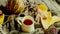 autumn background with leaves, dried grass, pumpkin, walnuts and tea mug on knitted blanket, fall mood, hello autumn