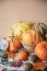 Autumn background, natural harvest of orange pumpkins on rustic wooden table