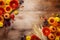 Autumn background with orange and yellow gerbera flowers, decorative pumpkins, berries, wheat ears. Composition for Thanksgiving