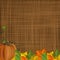 Autumn background with pumpkin and fallen leaves