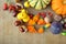 Autumn background with pumpkins, fruits and nuts