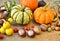 Autumn background with pumpkins, fruits and nuts