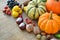 Autumn background with pumpkins, fruits and nuts