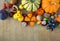 Autumn background with pumpkins, fruits and nuts