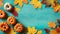 autumn background with pumpkins on a turquoise abstract wooden board