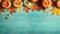 autumn background with pumpkins on a turquoise abstract wooden board