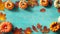 autumn background with pumpkins on a turquoise abstract wooden board