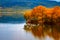 Autumn background with reflection colorful trees