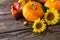 Autumn Background, Thanksgiving table. Pumpkins, sunflowers, apples and fallen leaves.