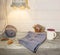 Autumn background, woolen mittens, colorful leaves, succulent, cup of coffee on a vintage wooden table and retro lamp