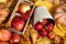 Autumn background from yellow leaves, apples, pumpkin. Fall season, eco food and harvest concept