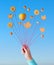 Autumn balloons, creative still life in blue and orange with cookies and autumn leaves on strings in hand