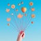 Autumn balloons, creative still life in blue and orange with cookies and autumn leaves on strings in hand