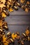 Autumn banner background with golden acorns and golden oak leaves on wooden background