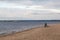 Autumn beach on the Volga. The lonely figure of a woman on the bench. The City Of Samara, Russia