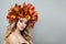 Autumn beauty. Beautiful model in colorful autumn leaves crown