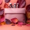 Autumn beauty essentials Pink leather clutch, makeup brushes, and leaves