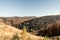 Autumn Beskid Zywiecki mountains on polish - slovakian borderland with hills covered by colorful forest and clear sky