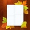 Autumn blank notepad on wood background