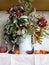 Autumn bouquet with branches and bunches of ash, pomegranate and pepper