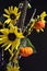 Autumn bouquet pumpkin on a stick sunflower millet grass purple filler closeup vertical