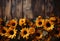 Autumn bouquet of sunflowers on a wooden background