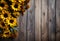 Autumn bouquet of yellow sunflowers on a wooden background