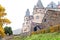 Autumn Burresheim Castle with topiary green trees in ornamental