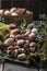 Autumn Cep Mushrooms. Ceps Boletus edulis over Wooden Background with moss, close up.  Gourmet food