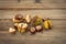 Autumn chestnuts on a wooden substrate.