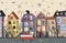 Autumn City Houses seamless background. Old city street. Ancient building border. Doodle pattern. Vector illustration.
