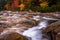 Autumn color and cascades on the Swift River, along the Kancamagus Highway in White Mountain National Forest, New Hampshire.