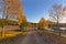 Autumn colored trees lined the dirt road