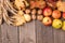 Autumn, colorful composition. Collections arranged in the upper part of the frame. Ears of wheat, onions, apples and pears.