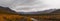 Autumn colorful tundra on the background mountain peaks in cloudy weather. Mountain landscape in Kola Peninsula, Arctic