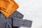 Autumn comfortable clothes. Trendy corduroy orange pants and warm gray jacket