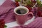Autumn composition: coffee mug with viburnum branches