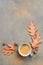 Autumn Composition with Cup of Coffee and Autumn Leaves on Stone or Concrete Background