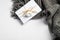 Autumn composition. Feminine desk table with knitted scarf and gift box on white background. Flat lay, top view. Nordic, hygge,