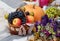 autumn composition fruit pumpkin flowers on the background of yellow leaves