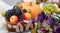 autumn composition fruit pumpkin flowers on the background of yellow leaves