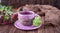 Autumn composition. Fruit tea, gingerbread oak leaf, books, knitted sweater and flowers asters on a wooden background. Free space