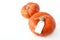 Autumn composition. Orange Hokkaido pumpkins with blank gift, price tags on white table background. Fall, Halloween and