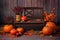 Autumn composition with orange pumpkins at a brown bench