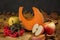 Autumn composition of a piece of pumpkin, apples and red viburnum berries, concept