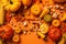 Autumn composition. Pumpkins, corn, leaves, nuts on orange background. Flat lay, top view, copy space. Generative AI